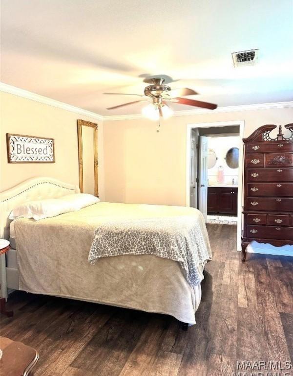 1915 Mckinley Ave, Montgomery, AL 36107 - bedroom with dark wood-type flooring, ornamental molding, a ceiling fan, and ensuite bath