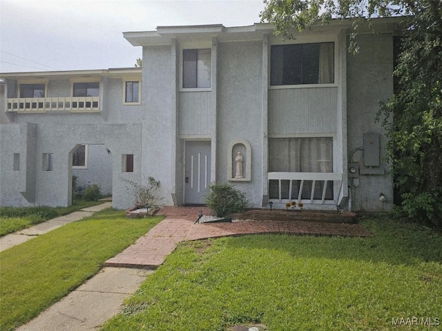 2631 Woodley Park Dr, Montgomery, AL 36116 - view of front of property with a front yard and stucco siding