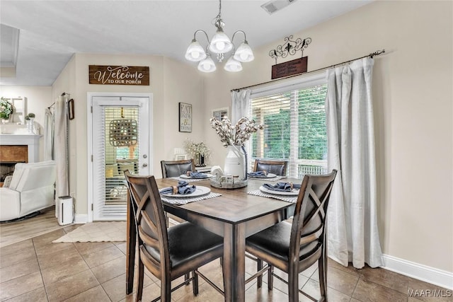 190 Sherwood Trl, Wetumpka, AL 36093 - tiled dining area with a chandelier, plenty of natural light, and baseboards