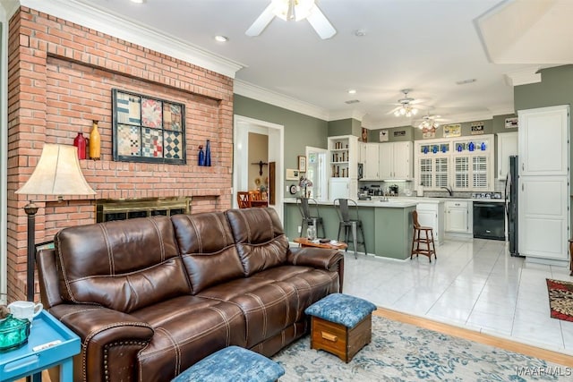 8054 Lakeridge Dr, Montgomery, AL 36117 - living area with a ceiling fan, a brick fireplace, ornamental molding, and recessed lighting