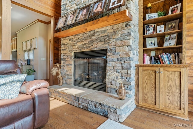 511 Mehearg Rd, Wetumpka, AL 36092 - living area featuring a stone fireplace, wood finished floors, and ornamental molding