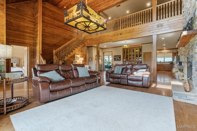 511 Mehearg Rd, Wetumpka, AL 36092 - living area with a high ceiling, wood finished floors, stairs, wooden walls, and recessed lighting
