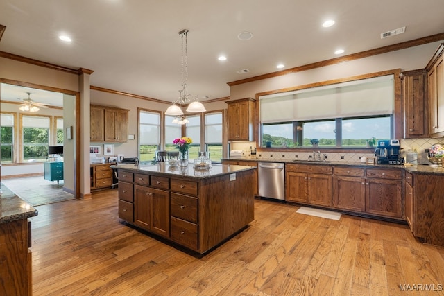 511 Mehearg Rd, Wetumpka, AL 36092 - kitchen with stainless steel dishwasher, crown molding, light wood-style flooring, tasteful backsplash, and recessed lighting