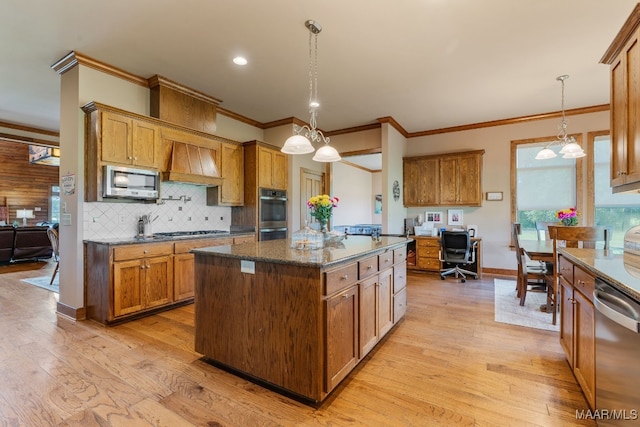 511 Mehearg Rd, Wetumpka, AL 36092 - kitchen with stainless steel appliances, premium range hood, crown molding, brown cabinets, and a center island