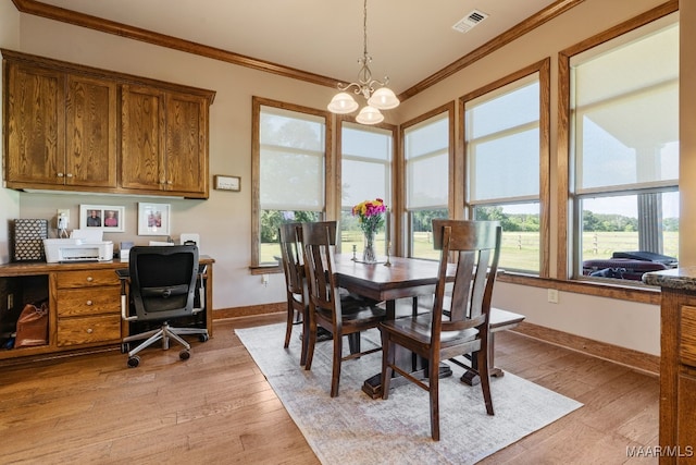 511 Mehearg Rd, Wetumpka, AL 36092 - dining room featuring ornamental molding, baseboards, light wood-style floors, and a chandelier