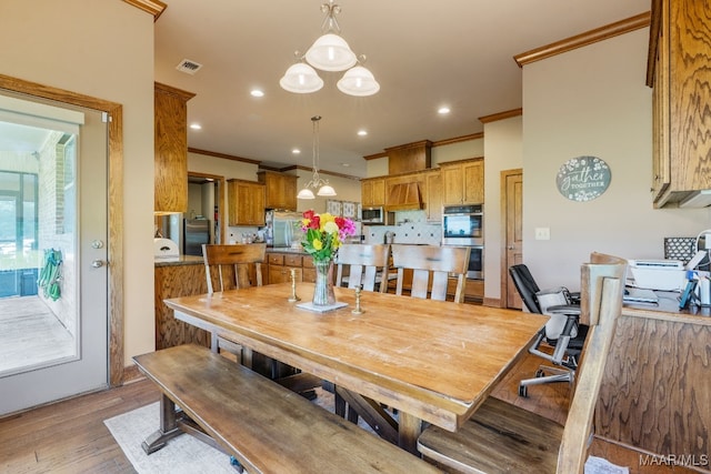 511 Mehearg Rd, Wetumpka, AL 36092 - dining area featuring ornamental molding, light wood finished floors, a chandelier, and recessed lighting