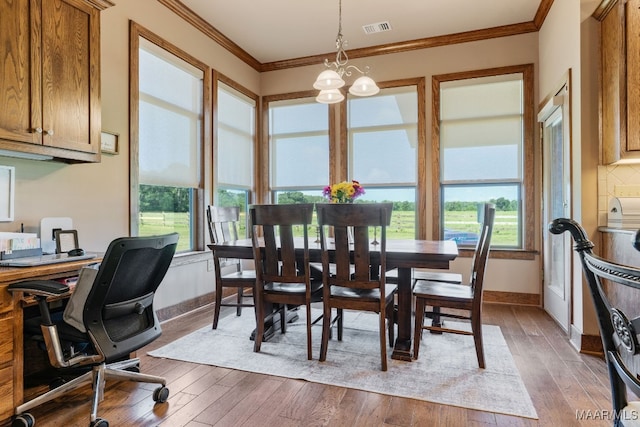 511 Mehearg Rd, Wetumpka, AL 36092 - dining room with crown molding, wood-type flooring, a chandelier, and a desk