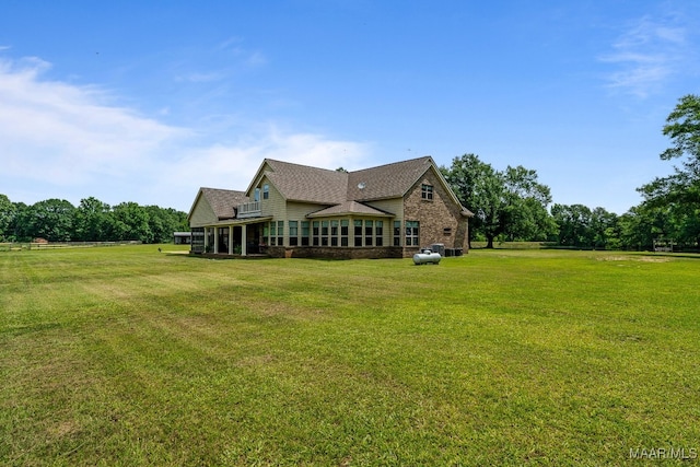 511 Mehearg Rd, Wetumpka, AL 36092 - back of house featuring a yard, brick siding, and a shingled roof