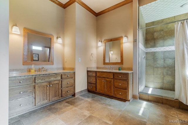 511 Mehearg Rd, Wetumpka, AL 36092 - bathroom featuring ornamental molding, a tile shower, and two vanities