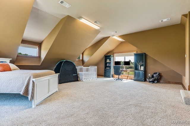 511 Mehearg Rd, Wetumpka, AL 36092 - carpeted bedroom with vaulted ceiling and baseboards