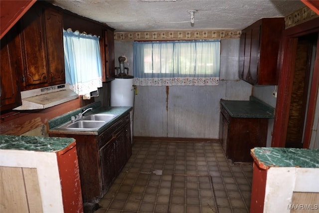 2612 Harris St, Selma, AL 36701 - kitchen featuring a sink, a textured ceiling, and tile patterned floors