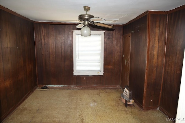 2612 Harris St, Selma, AL 36701 - carpeted spare room featuring wood walls and ceiling fan