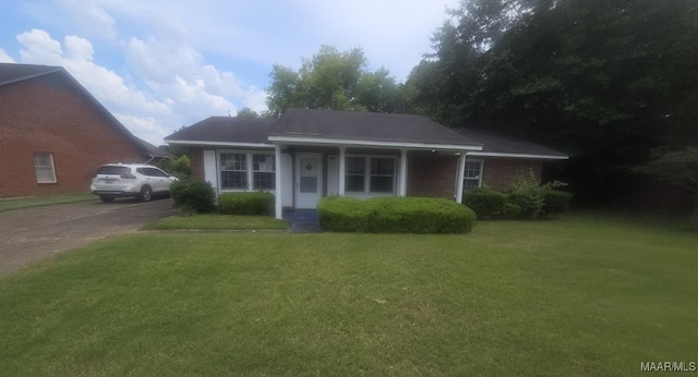 2930 Milton Rd, Montgomery, AL 36110 - view of front facade with a front yard, driveway, and brick siding