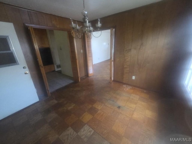 2930 Milton Rd, Montgomery, AL 36110 - unfurnished dining area featuring wood walls, a chandelier, and dark floors