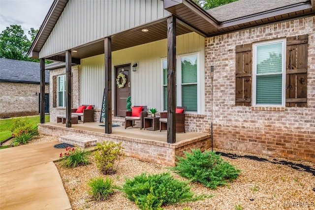 365 Wrightsburg Cir, Wetumpka, AL 36093 - view of exterior entry with a porch, brick siding, and a shingled roof