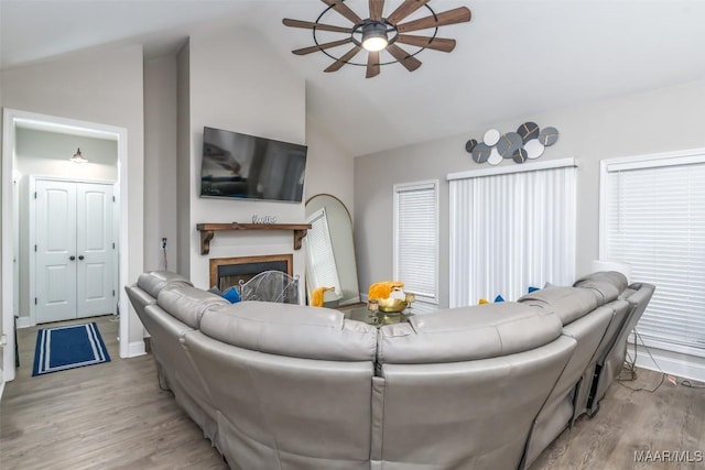 365 Wrightsburg Cir, Wetumpka, AL 36093 - living room featuring a ceiling fan, wood finished floors, a fireplace, and high vaulted ceiling