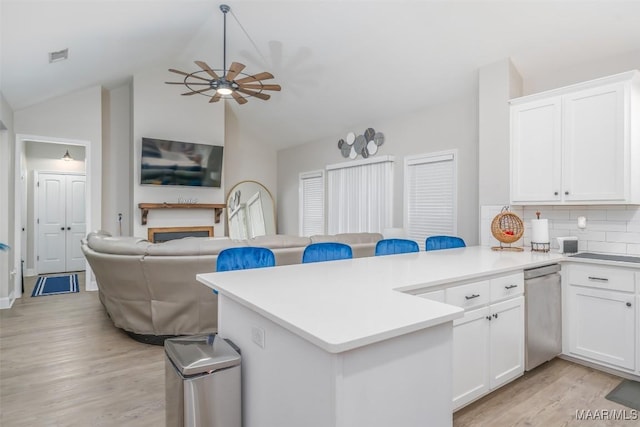 365 Wrightsburg Cir, Wetumpka, AL 36093 - kitchen featuring dishwasher, open floor plan, a ceiling fan, a peninsula, and light wood-type flooring