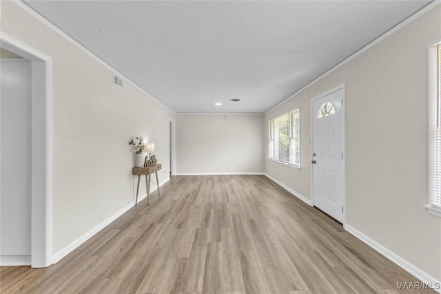 3556 Prince George Dr, Montgomery, AL 36109 - unfurnished living room featuring light wood finished floors, ornamental molding, baseboards, and recessed lighting