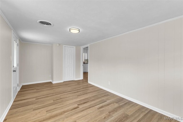 3556 Prince George Dr, Montgomery, AL 36109 - spare room featuring light wood-style floors, baseboards, and ornamental molding