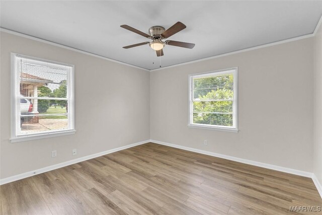 3556 Prince George Dr, Montgomery, AL 36109 - empty room with crown molding, light wood-style floors, baseboards, and a ceiling fan