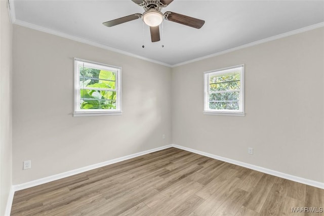 3556 Prince George Dr, Montgomery, AL 36109 - empty room with wood finished floors, healthy amount of natural light, baseboards, and crown molding