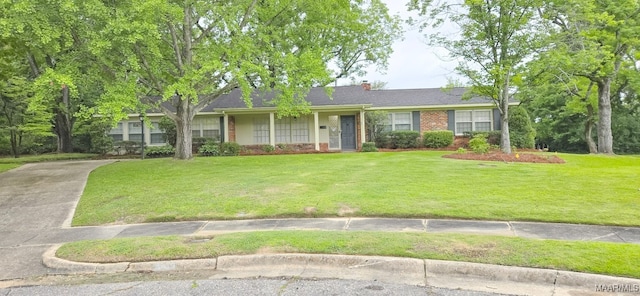 2728 Oxford Dr, Montgomery, AL 36111 - ranch-style home with brick siding, a front lawn, a chimney, and concrete driveway
