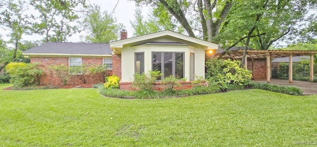 2728 Oxford Dr, Montgomery, AL 36111 - rear view of house with a chimney, a lawn, and a pergola