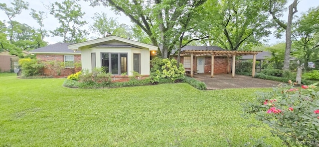 2728 Oxford Dr, Montgomery, AL 36111 - rear view of property featuring a pergola, a lawn, and brick siding