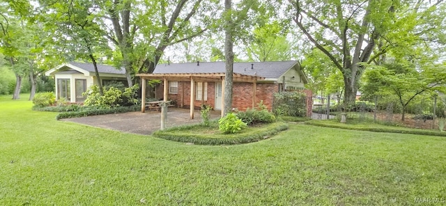 2728 Oxford Dr, Montgomery, AL 36111 - back of property featuring a patio, a lawn, and brick siding