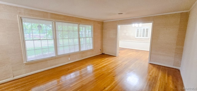 2728 Oxford Dr, Montgomery, AL 36111 - unfurnished room featuring crown molding, plenty of natural light, and wood finished floors