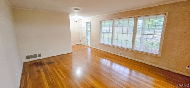 2728 Oxford Dr, Montgomery, AL 36111 - empty room featuring crown molding and wood finished floors