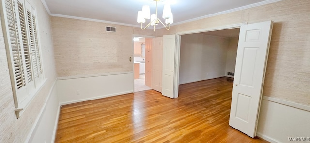 2728 Oxford Dr, Montgomery, AL 36111 - unfurnished bedroom featuring a chandelier, wood finished floors, crown molding, and a closet