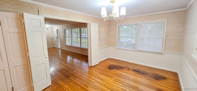 2728 Oxford Dr, Montgomery, AL 36111 - spare room featuring a chandelier, light wood finished floors, and crown molding
