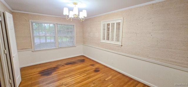 2728 Oxford Dr, Montgomery, AL 36111 - empty room with a chandelier, ornamental molding, and wood finished floors