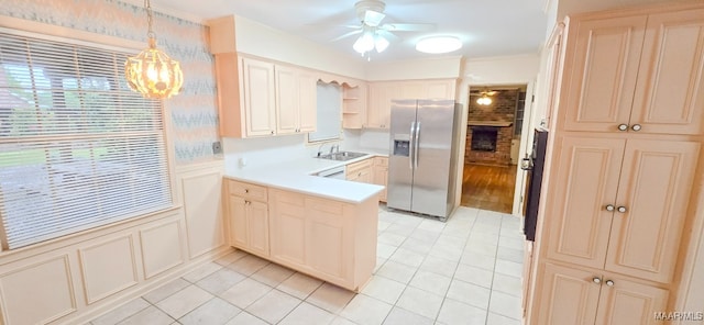 2728 Oxford Dr, Montgomery, AL 36111 - kitchen with stainless steel fridge, a ceiling fan, a peninsula, plenty of natural light, and ornamental molding