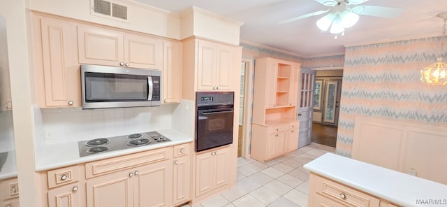2728 Oxford Dr, Montgomery, AL 36111 - kitchen with black oven, stainless steel microwave, electric stovetop, a ceiling fan, and light countertops