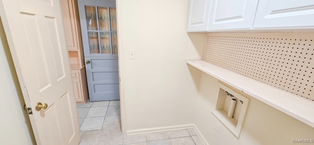 2728 Oxford Dr, Montgomery, AL 36111 - washroom with light tile patterned floors and baseboards