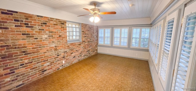 2728 Oxford Dr, Montgomery, AL 36111 - unfurnished sunroom featuring brick wall and crown molding