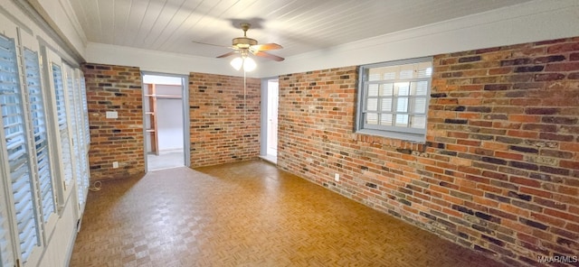 2728 Oxford Dr, Montgomery, AL 36111 - unfurnished room featuring brick wall, a ceiling fan, and crown molding