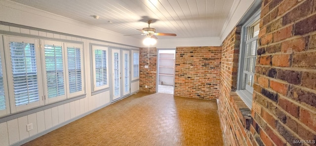 2728 Oxford Dr, Montgomery, AL 36111 - spare room featuring brick wall, ceiling fan, crown molding, and wood ceiling