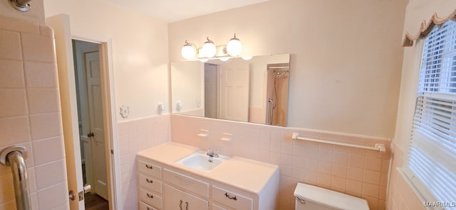 2728 Oxford Dr, Montgomery, AL 36111 - bathroom with tile walls, vanity, and wainscoting