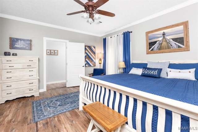 28 Lake Region Dr, Wetumpka, AL 36092 - bedroom featuring crown molding, wood finished floors, baseboards, and ceiling fan
