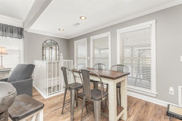 28 Lake Region Dr, Wetumpka, AL 36092 - dining area featuring light wood-type flooring, ornamental molding, baseboards, and recessed lighting