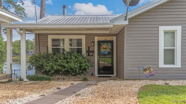28 Lake Region Dr, Wetumpka, AL 36092 - view of exterior entry featuring metal roof and covered porch