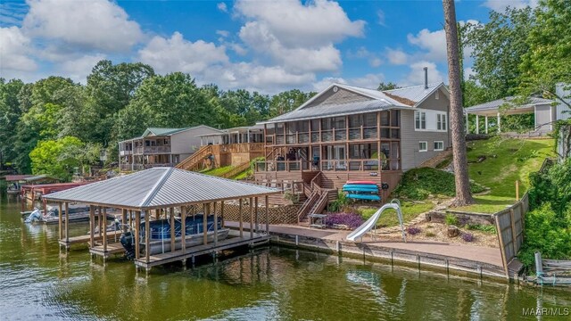 28 Lake Region Dr, Wetumpka, AL 36092 - dock area with stairway, boat lift, and a deck with water view