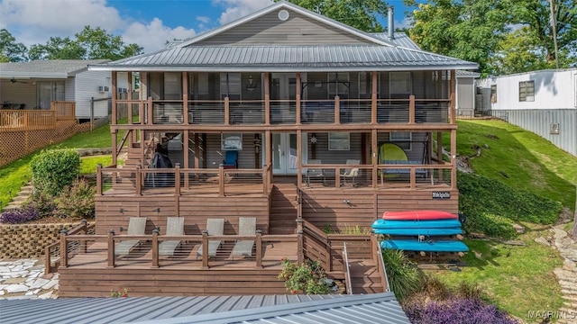 28 Lake Region Dr, Wetumpka, AL 36092 - rear view of house featuring a sunroom, a deck, and metal roof