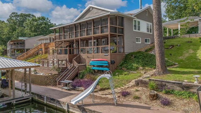 28 Lake Region Dr, Wetumpka, AL 36092 - rear view of property with stairs, a sunroom, a deck, and a yard