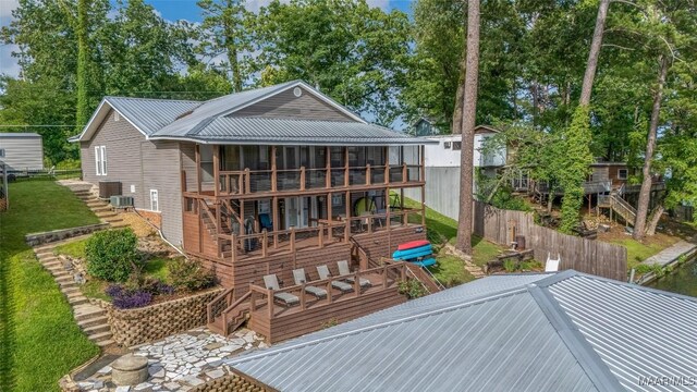 28 Lake Region Dr, Wetumpka, AL 36092 - rear view of house featuring stairs, a deck, metal roof, and a sunroom