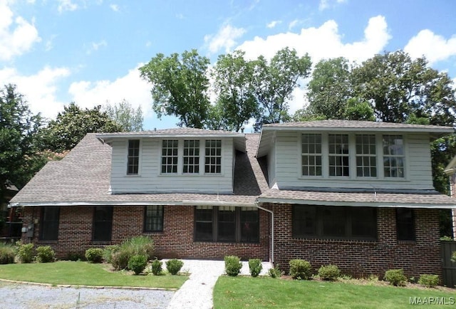 812 E Fairview Ave, Montgomery, AL 36106 - view of front of property featuring brick siding, roof with shingles, and a front lawn