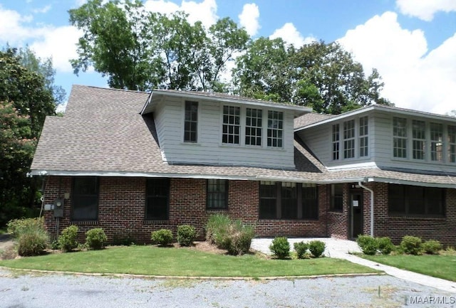 812 E Fairview Ave, Montgomery, AL 36106 - view of front of property with brick siding, a shingled roof, and a front yard